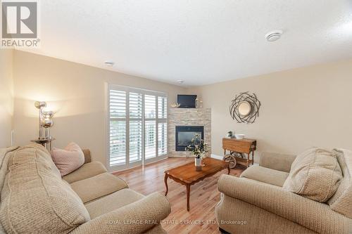 406 - 12 St Andrew Street, Norfolk (Port Dover), ON - Indoor Photo Showing Living Room With Fireplace