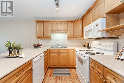 406 - 12 St Andrew Street, Norfolk (Port Dover), ON - Indoor Photo Showing Kitchen With Double Sink