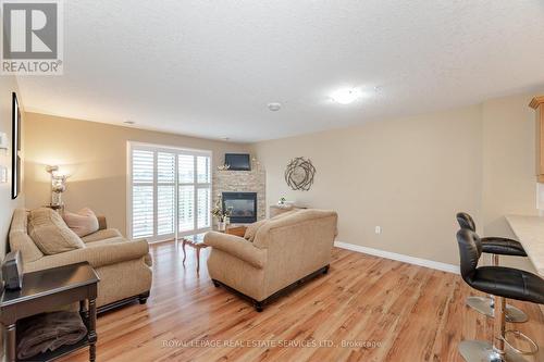 406 - 12 St Andrew Street, Norfolk (Port Dover), ON - Indoor Photo Showing Living Room With Fireplace