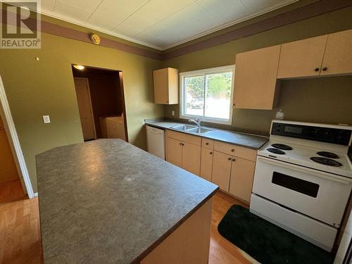 7687 Riverside Drive, Grand Forks, BC - Indoor Photo Showing Kitchen With Double Sink