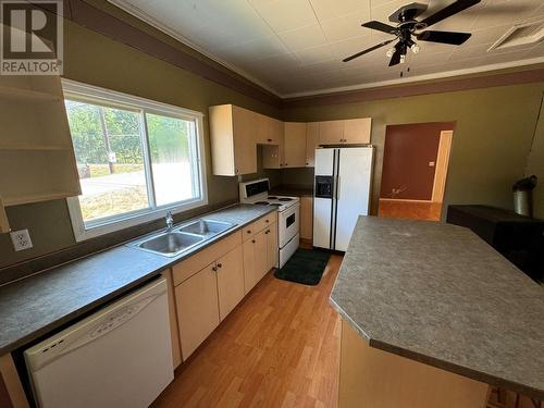 7687 Riverside Drive, Grand Forks, BC - Indoor Photo Showing Kitchen With Double Sink