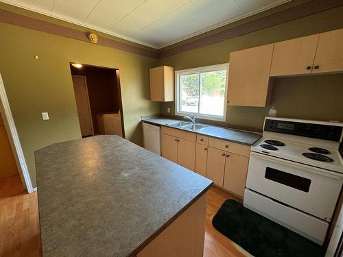 7687 Riverside Drive, Grand Forks, BC - Indoor Photo Showing Kitchen With Double Sink