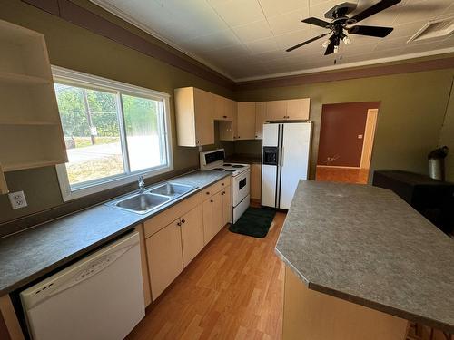 7687 Riverside Drive, Grand Forks, BC - Indoor Photo Showing Kitchen With Double Sink