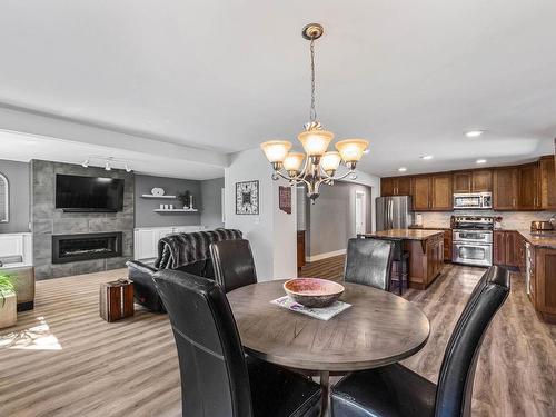 8661 Skimikin Rd, Chase, BC - Indoor Photo Showing Dining Room With Fireplace