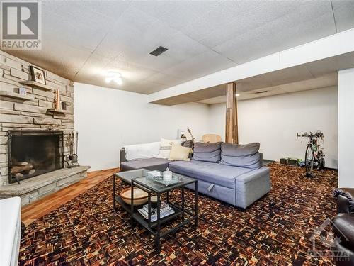 Basement Rec Room - 90 Fieldrow Street, Ottawa, ON - Indoor Photo Showing Living Room With Fireplace