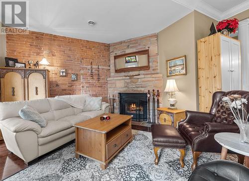 6 - 19 Main Street E, Westport, ON - Indoor Photo Showing Living Room With Fireplace