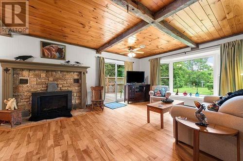 1505 Sheridan Rapids Road, Lanark Highlands, ON - Indoor Photo Showing Living Room With Fireplace