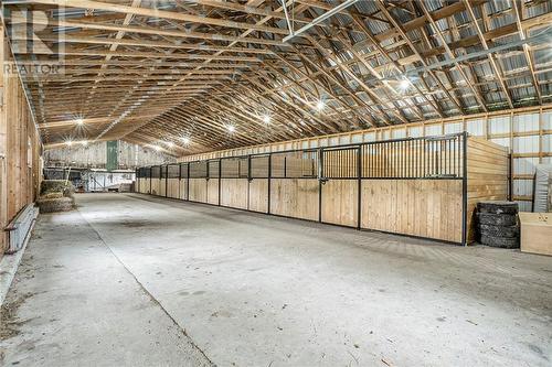 New barn with concrete floor and 7 new stalls - 212 Franks Road, Rideau Lakes, ON - Indoor Photo Showing Garage