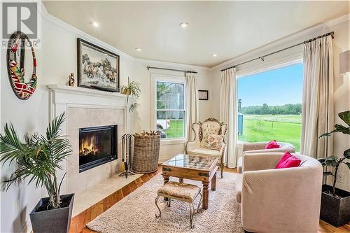 Family room with fireplace - 212 Franks Road, Rideau Lakes, ON - Indoor Photo Showing Living Room With Fireplace