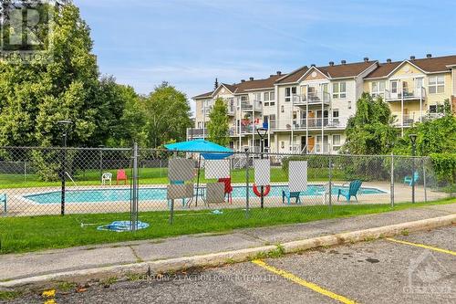 202 - 1599 Lassiter Terrace, Ottawa, ON - Outdoor With In Ground Pool