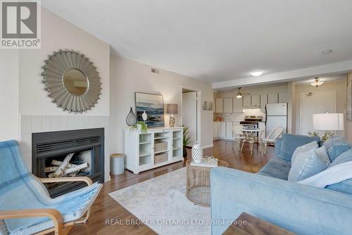 207 - 120 Bell Farm Road, Barrie (Alliance), ON - Indoor Photo Showing Living Room With Fireplace