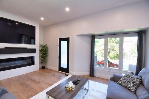 72 Stone Church Road W|Unit #11, Hamilton, ON - Indoor Photo Showing Living Room With Fireplace