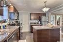 328 Stevens Avenue, Birch Hills, SK  - Indoor Photo Showing Kitchen With Stainless Steel Kitchen With Double Sink 