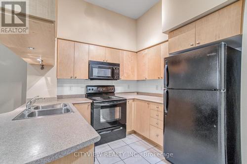 109 - 320 City Centre Drive, Mississauga (City Centre), ON - Indoor Photo Showing Kitchen With Double Sink