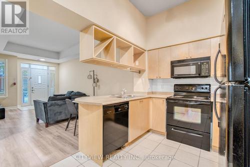 109 - 320 City Centre Drive, Mississauga (City Centre), ON - Indoor Photo Showing Kitchen With Double Sink