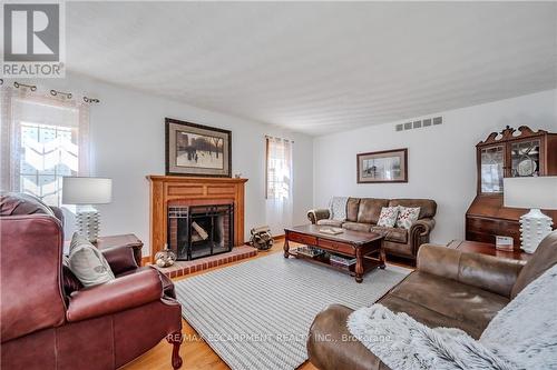 1930 West River Road, North Dumfries, ON - Indoor Photo Showing Living Room With Fireplace