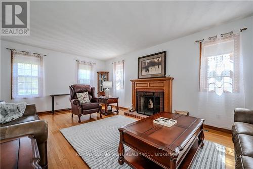 1930 West River Road, North Dumfries, ON - Indoor Photo Showing Living Room With Fireplace