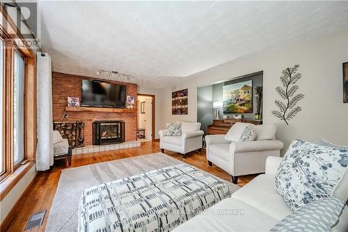 1930 West River Road, North Dumfries, ON - Indoor Photo Showing Living Room With Fireplace