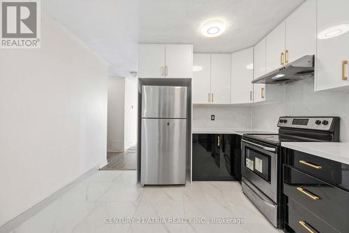 207 - 40 Sunny Glenway, Toronto (Flemingdon Park), ON - Indoor Photo Showing Kitchen With Stainless Steel Kitchen With Upgraded Kitchen