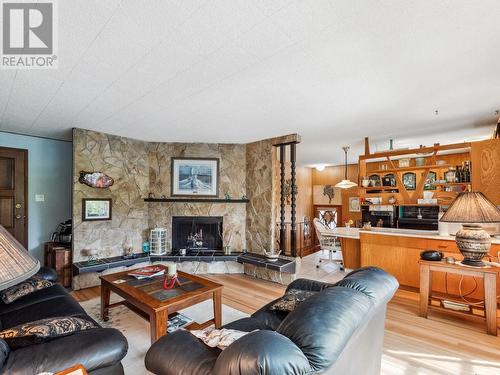 1150 Marianna  Crescent, Trail, BC - Indoor Photo Showing Living Room With Fireplace