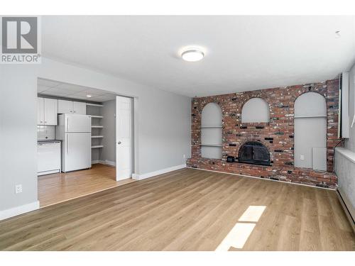 7005 Longacre Drive, Vernon, BC - Indoor Photo Showing Living Room With Fireplace