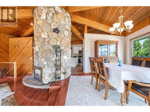 2100 40Th Street, Vernon, BC - Indoor Photo Showing Dining Room With Fireplace