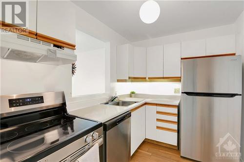 New in 2024: fridge, stove and dishwasher. Some personal items were digitally removed. - 40 Pearl Street Unit#109, Smiths Falls, ON - Indoor Photo Showing Kitchen With Stainless Steel Kitchen