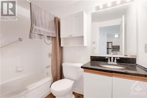 4 piece bath with granite counters and tile flooring. Personal items in unit were digitally removed. - 40 Pearl Street Unit#109, Smiths Falls, ON - Indoor Photo Showing Bathroom