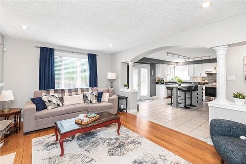 family room open to kitchen - 54 Stonepine Crescent, Hamilton, ON - Indoor Photo Showing Living Room