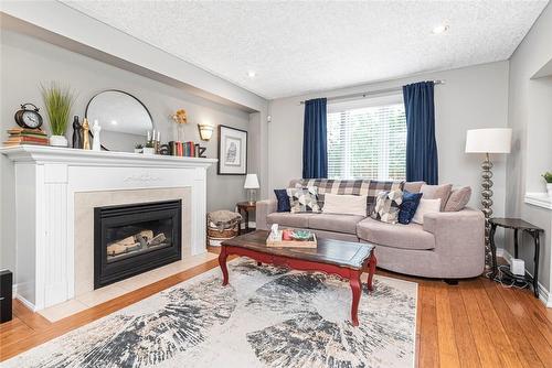 featuring gas fireplace - 54 Stonepine Crescent, Hamilton, ON - Indoor Photo Showing Living Room With Fireplace