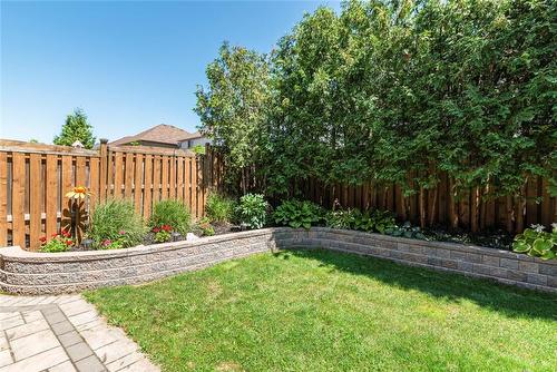 stone retaining wall with gardens - 54 Stonepine Crescent, Hamilton, ON - Outdoor