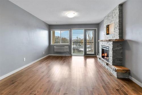 306-1777 Water Street, Kelowna, BC - Indoor With Fireplace