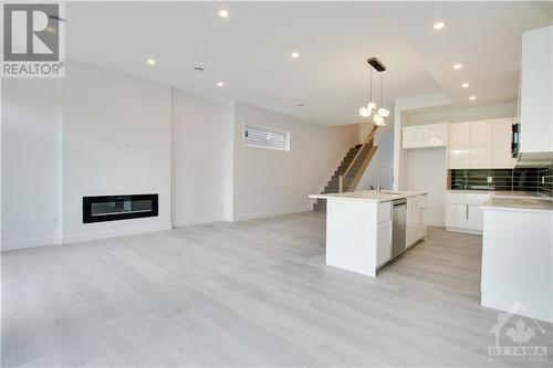 133 Duford Street Unit#A, Ottawa, ON - Indoor Photo Showing Kitchen With Fireplace