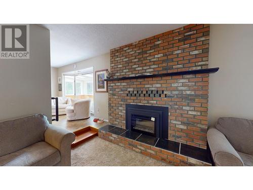 891 Funn Street, Quesnel, BC - Indoor Photo Showing Living Room With Fireplace