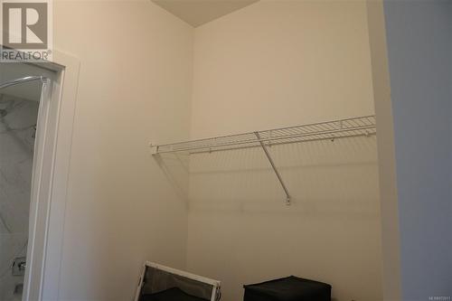 2nd Bedroom Walk through closet - 405 3070 Kilpatrick Ave, Courtenay, BC - Indoor With Storage