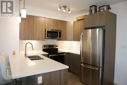 Alternative Kitchen View, stainless steel appliances - 405 3070 Kilpatrick Ave, Courtenay, BC - Indoor Photo Showing Kitchen With Stainless Steel Kitchen With Double Sink With Upgraded Kitchen