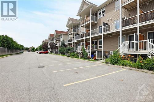 dedicated parking spot you can see from your balcony - 202 Chapman Mills Drive, Ottawa, ON - Outdoor With Balcony