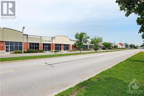 Located across from the grocery store, restaurants, a clinic and shopping! - 202 Chapman Mills Drive, Ottawa, ON - Outdoor