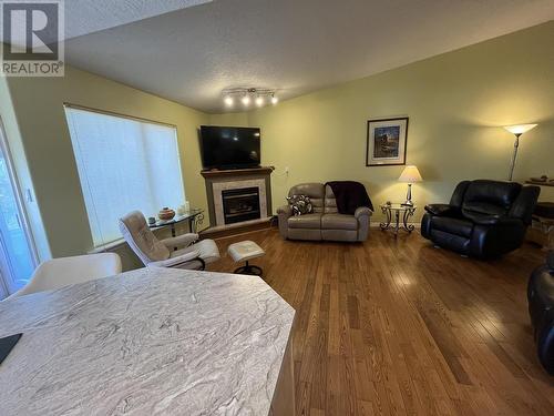 6 11 Eagle Crescent, Williams Lake, BC - Indoor Photo Showing Living Room With Fireplace