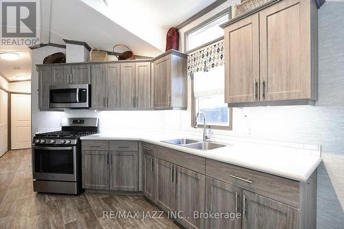 819 - 225 Platten Boulevard, Scugog (Port Perry), ON - Indoor Photo Showing Kitchen With Double Sink