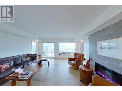 131 Harbourfront Drive Ne Unit# 402, Salmon Arm, BC - Indoor Photo Showing Living Room With Fireplace