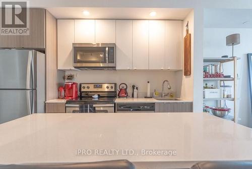 C406 - 5260 Dundas Street, Burlington (Orchard), ON - Indoor Photo Showing Kitchen With Stainless Steel Kitchen With Upgraded Kitchen