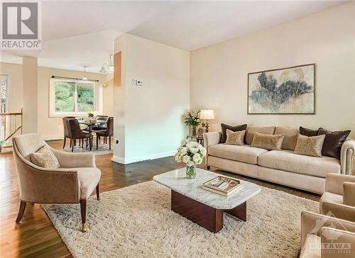 This image has been virtually staged. - 18 Drumso Street, Ottawa, ON - Indoor Photo Showing Living Room