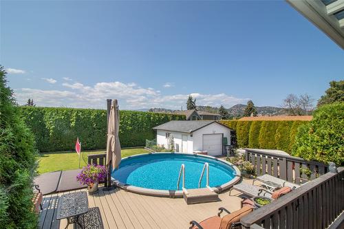 1310 Mary Court, Kelowna, BC - Outdoor With Above Ground Pool