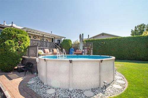 1310 Mary Court, Kelowna, BC - Outdoor With Above Ground Pool With Backyard