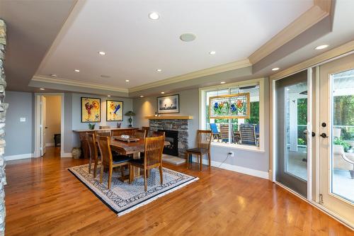 1501 18 Avenue, Salmon Arm, BC - Indoor Photo Showing Dining Room With Fireplace