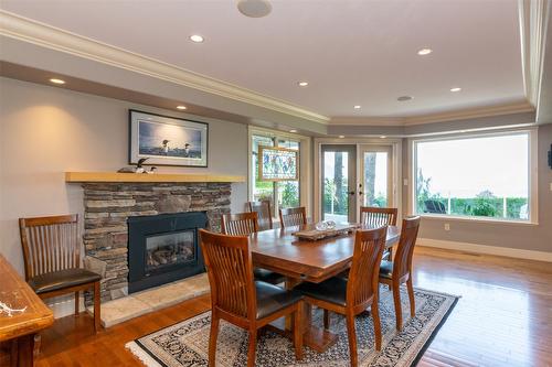 1501 18 Avenue, Salmon Arm, BC - Indoor Photo Showing Dining Room With Fireplace