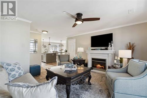 1510 Venetian Boulevard Unit# M7, Point Edward, ON - Indoor Photo Showing Living Room With Fireplace