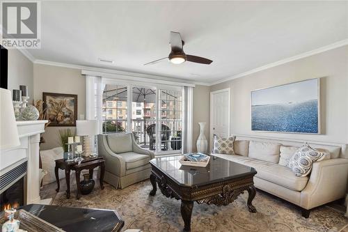 1510 Venetian Boulevard Unit# M7, Point Edward, ON - Indoor Photo Showing Living Room With Fireplace