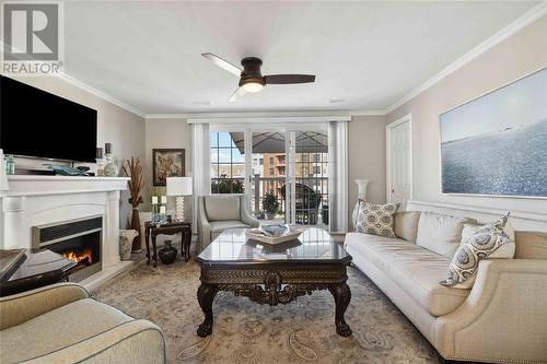 1510 Venetian Boulevard Unit# M7, Point Edward, ON - Indoor Photo Showing Living Room With Fireplace